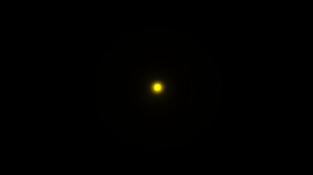 Glowing yellow circle shrinks as concentric rings expand on a black background