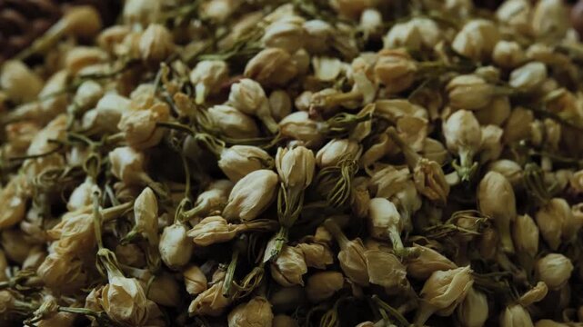 Dried jasmine flowers prepared as a natural ingredient for brewing fragrant jasmine flower tea.