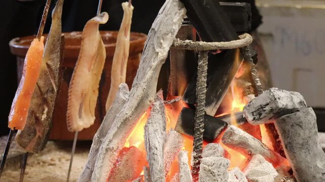 Traditional Japanese Robatayaki Seafood Grilling Station with Charcoal Fire in a Japanese Restaurant