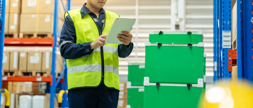 Asian male factory manager inspect goods in warehouse or inventory and check stock product. Transport logistic business shipping, delivery to customers. inspection, storehouse, storage, factory