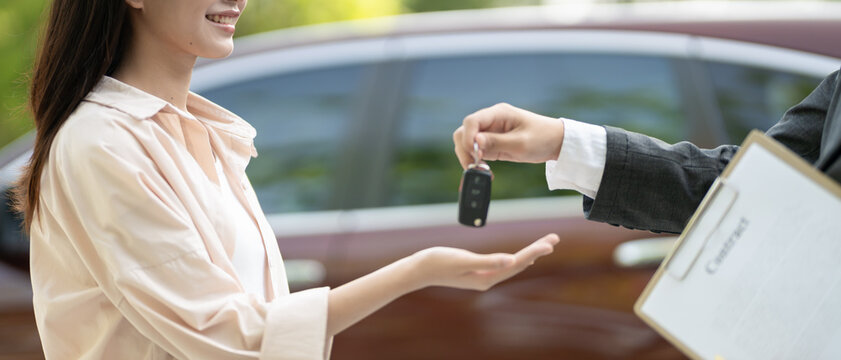 lease, rental car, sell, buy. Dealership manager send car keys to the new owner. Sales, loan credit financial, rent vehicle, insurance,  renting, Seller, dealer, installment, car care business