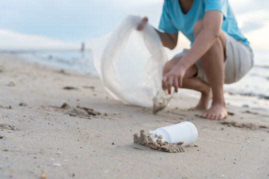 Save water. Volunteer pick up trash garbage at the beach and plastic bottles are difficult decompose prevent harm aquatic life. Earth, Environment, Greening planet, reduce global warming, Save world
