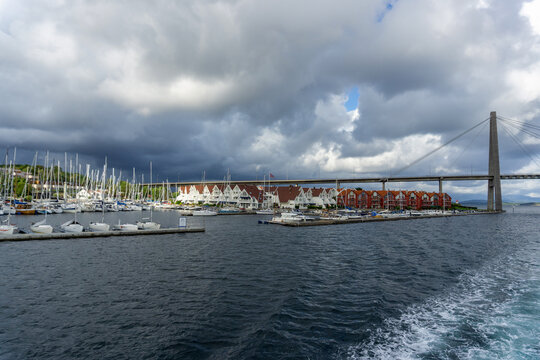 Grasholmen marina with sailboats, Stavanger City Bridge, and modern buildings