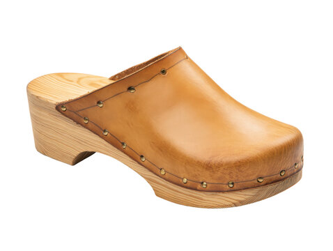 A single, traditional clog shoe crafted from natural tan leather and a light wood sole, featuring decorative metal rivets along the edge