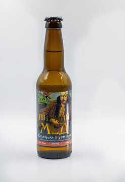 Honey drink Cossack craft bottle closeup on white.