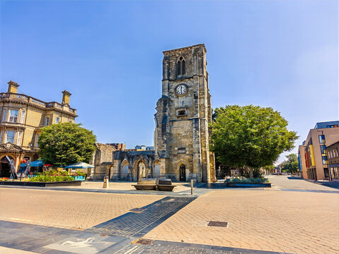A view towards the historic shell of Holyrood Church on the High Street in Southampton, England, in summertime 