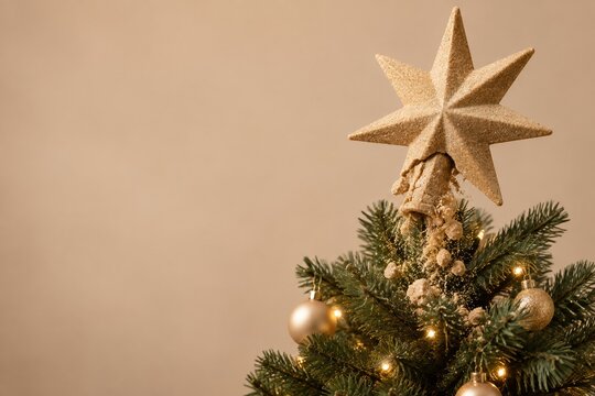 Christmas tree topper star crumbling into dry sand over green branches, featuring a gritty texture and warm beige background with copy space