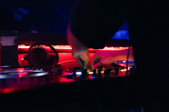 Anonymous DJ mixing music
