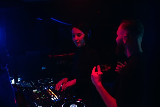 DJs are playing music and dancing