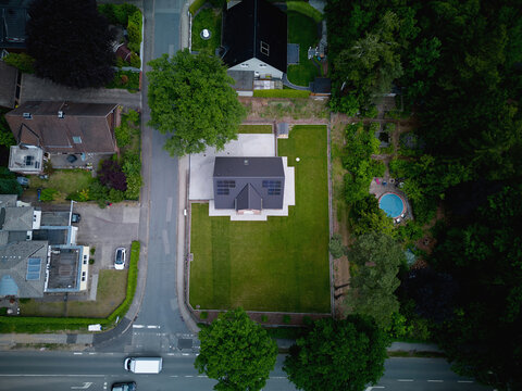 Bird's Eye View of a House With Green Lawn and Surrounding Area