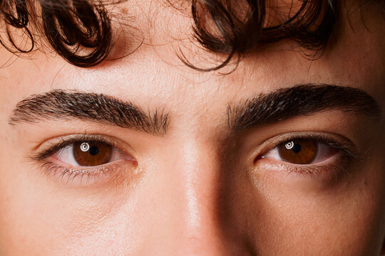 Close up of a Person's Eyes and Face With Curly Hair