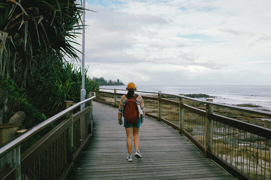 Woman walking on a boardwalk in Queensland