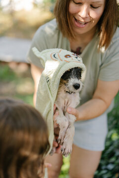 Puppy wrapped in soft towel