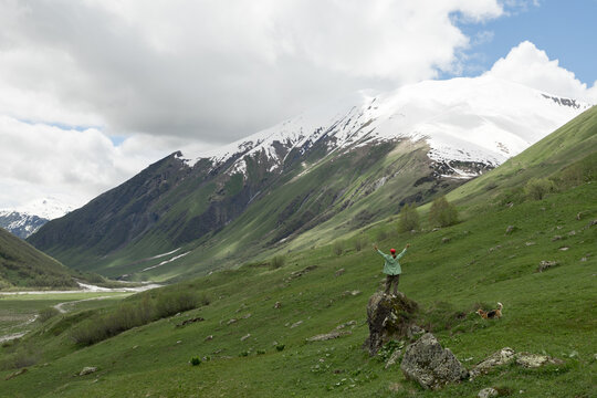 Person enjoying panoramic view of Shkhara Glacier