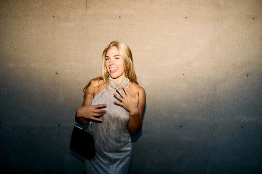 Excited young woman showing off her engagement ring