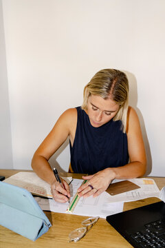 Architect drawing floor plans at home office desk
