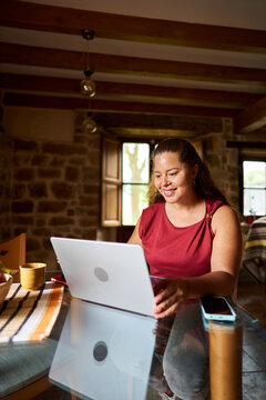 Woman freelancer working remotely from home online