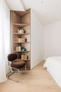 Built in shelving and armchair corner