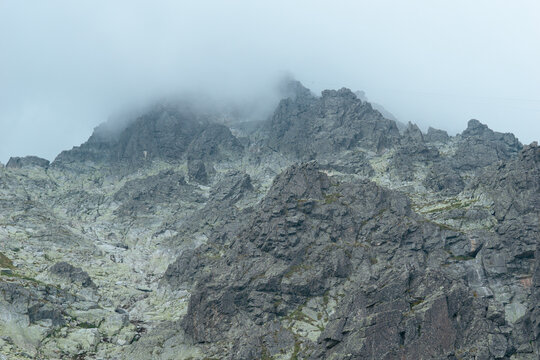 lomnicky stit peak rocky mountain summit fog clouds gray stone ridge high tatras slovakia alpine landscape aerial view concept of nature, travel, tourism