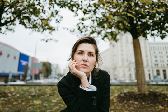 Reflective Moments in a Bustling Urban Park