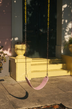 Pink swing on public sidewalk in New Orleans