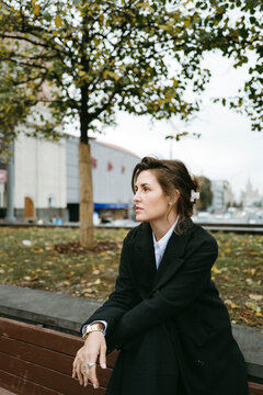 Contemplative Moments During Autumn Walks in the Bustling City