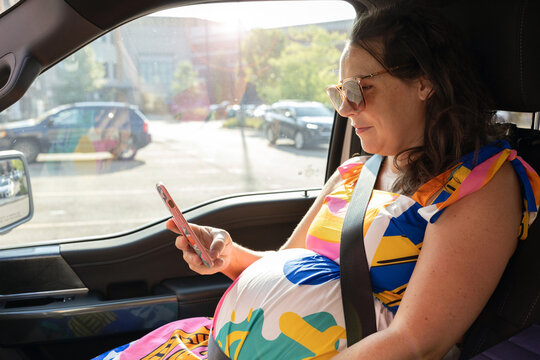 Mother texting in car