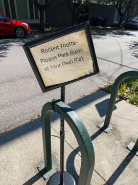 Bike Theft Sign on City Sidewalk