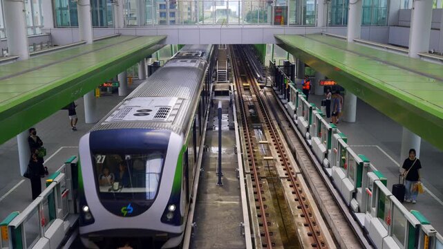 Taichung, Taiwan-6.20.2026: The Taichung MRT train climbs the ramp and enters the station