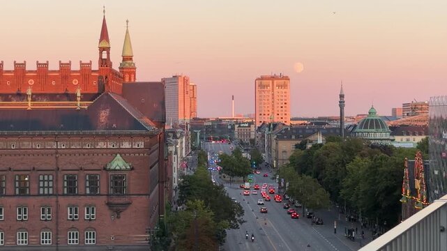 Rooftop View Over a City Boulevard in Pink Sunset Light
