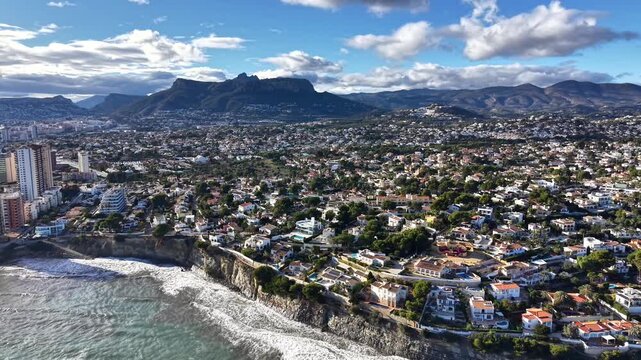 Coastal Aerial City View With Waves, Cliffside Neighborhoods, Sunlit Villas, Distant Mountains, Scattered