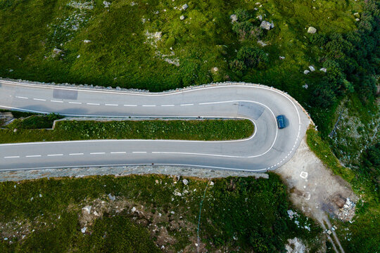 Scenic view of Furka Pass winding through green mountains in Switzerland
