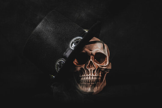 Gothic skull wearing vintage top hat with eerie smoke