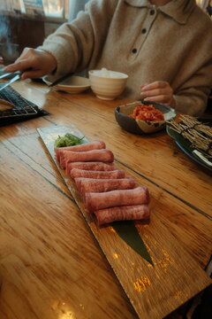 meat and vegetables on a wooden board