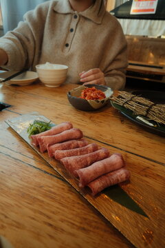 meat and vegetables on a wooden board