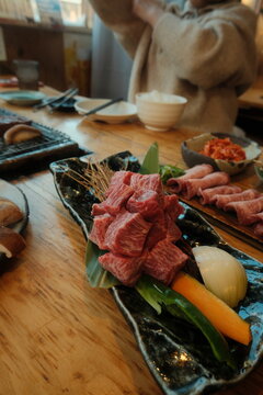 meat and vegetables on a wooden board