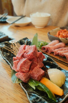 meat and vegetables on a wooden board