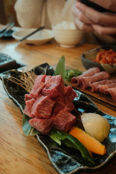 meat and vegetables on a wooden board