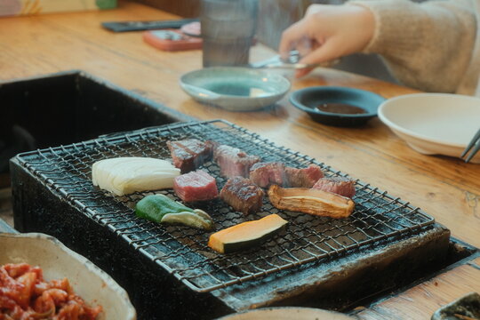 meat and vegetables on a wooden board
