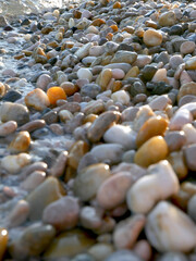 close up of some colorfoul pebbles being hit by the waves at a beach in Baska, Croatia © Isabella