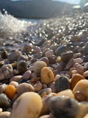 close up of some colorfoul pebbles being hit by the waves at a beach in Baska, Croatia © Isabella