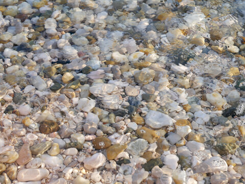 close up of some colorfoul pebbles underwater at a beach in Baska, Croatia