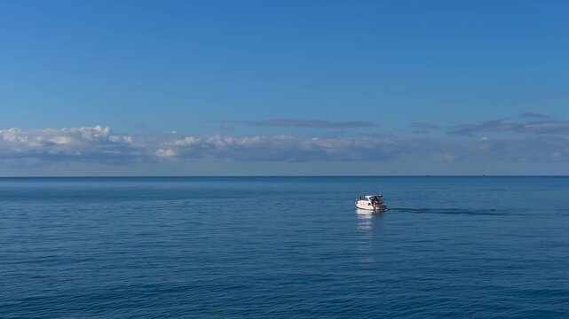 Motorboat cruising in wide sea view across calm Black Sea water near Batumi, Georgia, suited for marine tourism, leisure boating, coastal travel, charter services and maritime recreation advertising