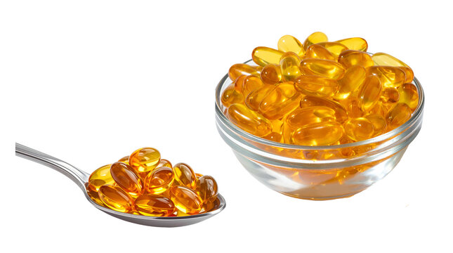 Golden fish oil capsules in glass bowl and spoon. Omega-3 vitamin softgels for health. Yellow supplement pills on white background.