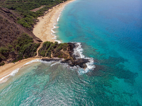 Aerial View of Big Beach and Little Beach separated by Puʻu Ōlaʻi at Makena, Maui