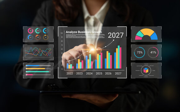 A professional analyzing business growth through digital graphs and charts, showcasing future projections and performance metrics for effective decision-making. Cyphers