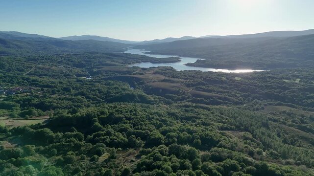 Aerial view of As Conchas reservoir and dense forest in Ourense