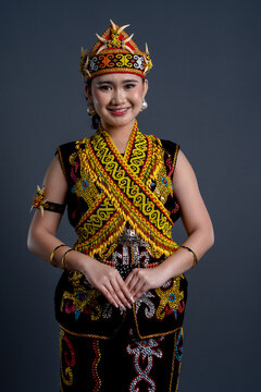 Portrait of beautiful young woman in Kenyah Orang Ulu traditional cloth