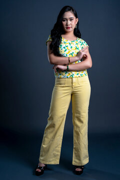 Portrait of young woman in yellow theme cloth