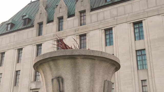 Ottawa, Ontario, Canada - September 12, 2026: Close Up View of Supreme Court of Canada Building Exterior Facade with Large Urn